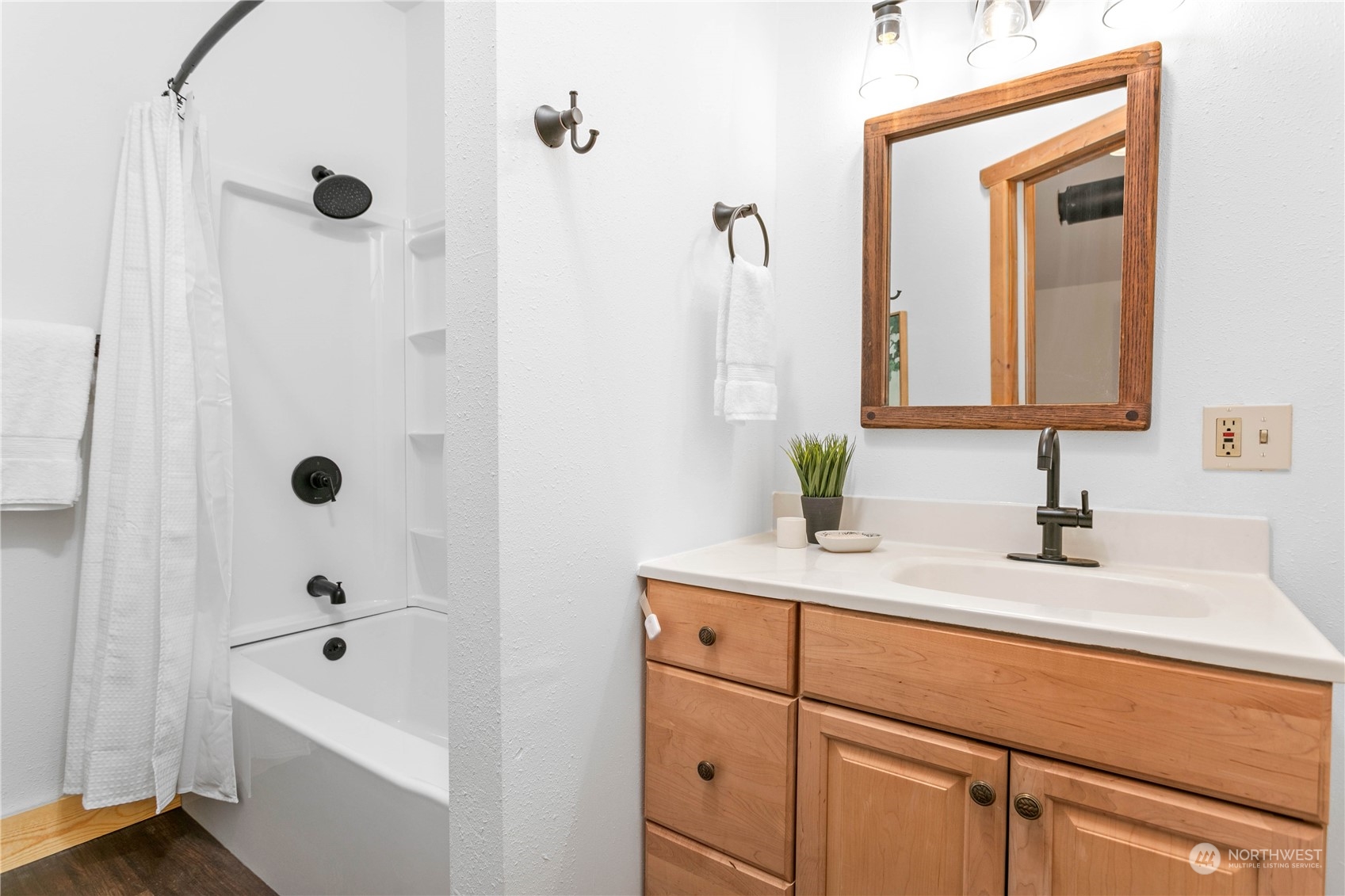3900 Bay Road Ferndale, WA 98248 - Photo 16 of 40 a bathroom with a tub sink and mirror
