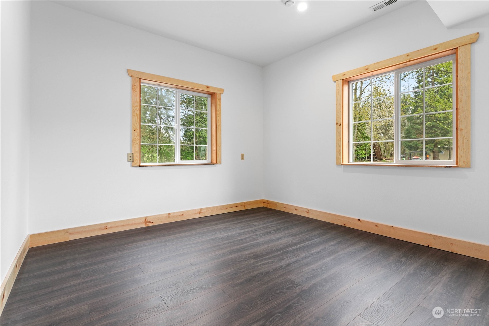 3900 Bay Road Ferndale, WA 98248 - Photo 17 of 40 a view of an empty room with wooden floor and a window
