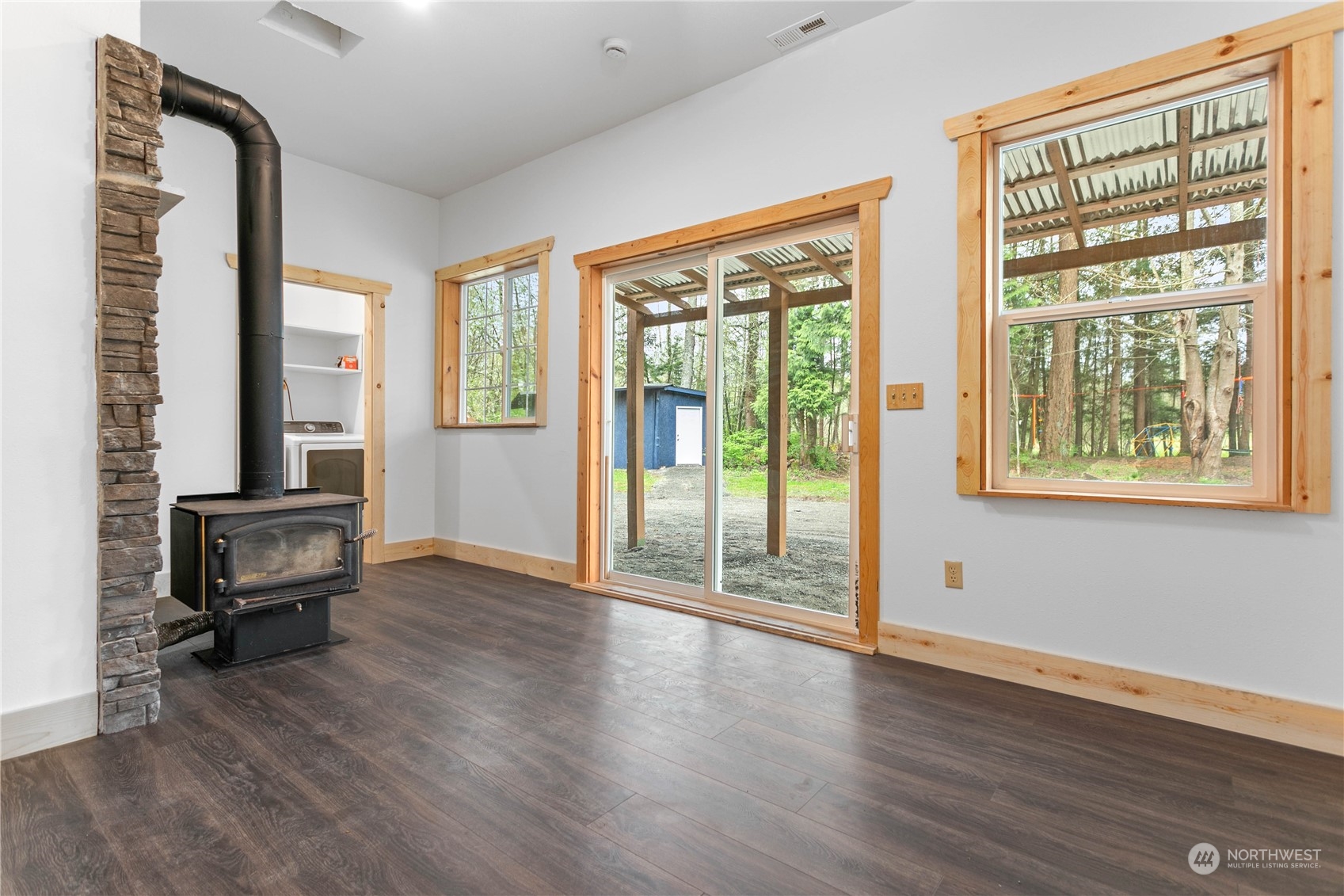 3900 Bay Road Ferndale, WA 98248 - Photo 20 of 40 a view of room with window wooden floor and furniture