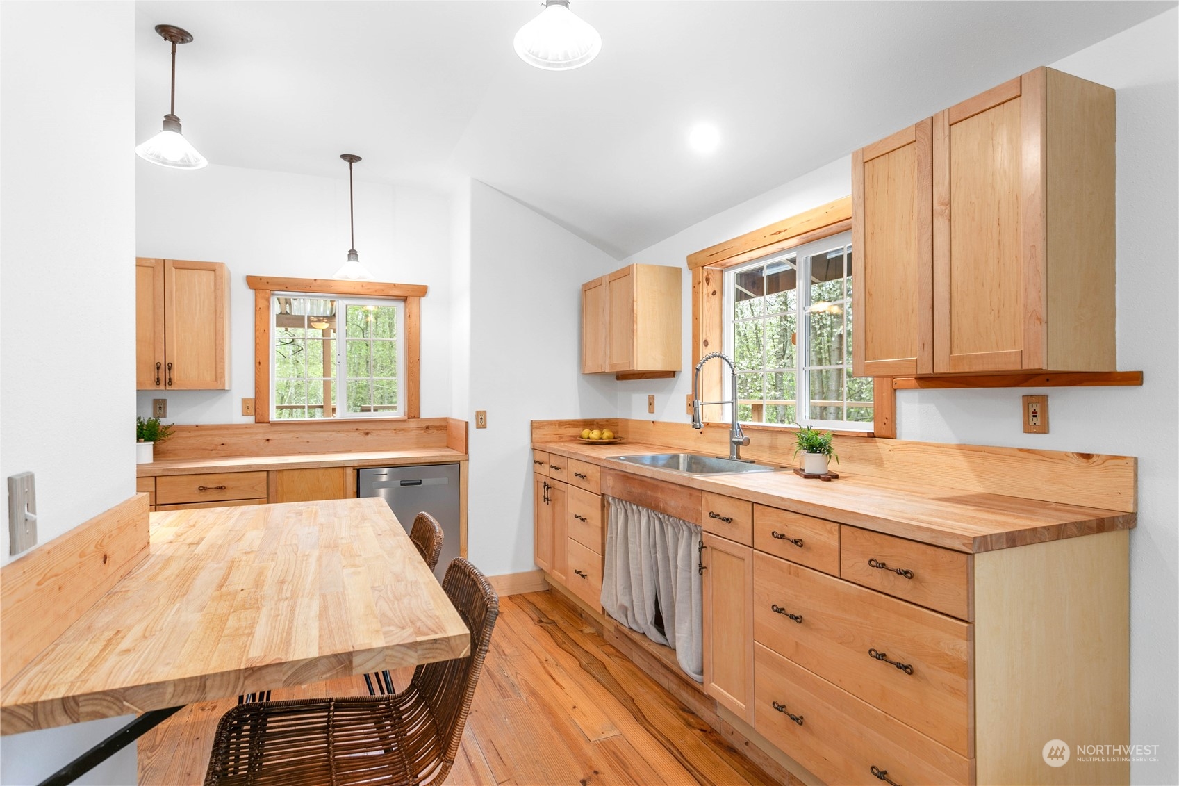 3900 Bay Road Ferndale, WA 98248 - Photo 5 of 40 a open kitchen with a sink a stove a refrigerator cabinets and a window