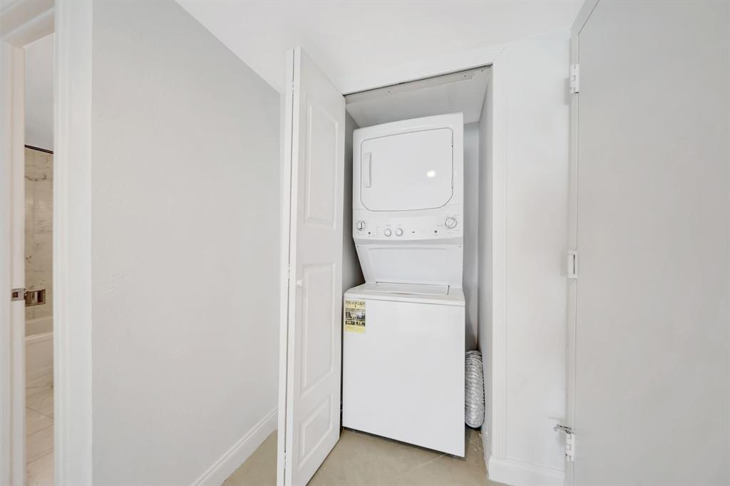 1360 South Ocean Boulevard, Unit 905 Pompano Beach, FL 33062 - Photo 16 of 57 a utility room with dryer and washer