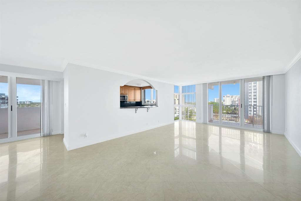 1360 South Ocean Boulevard, Unit 905 Pompano Beach, FL 33062 - Photo 2 of 57 a view of an empty room with glass door