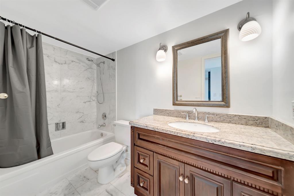 1360 South Ocean Boulevard, Unit 905 Pompano Beach, FL 33062 - Photo 27 of 57 a bathroom with a granite countertop sink toilet and shower