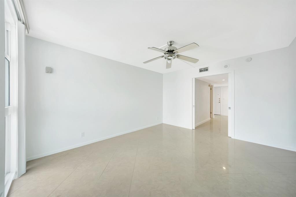 1360 South Ocean Boulevard, Unit 905 Pompano Beach, FL 33062 - Photo 30 of 57 a view of an empty room with a chandelier fan