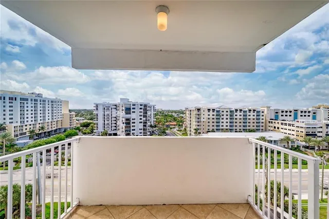 a view of a brick building from a balcony