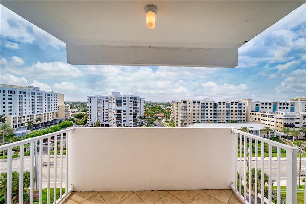 1360 South Ocean Boulevard, Unit 905 Pompano Beach, FL 33062 - Photo 33 of 57 a view of a balcony with city view