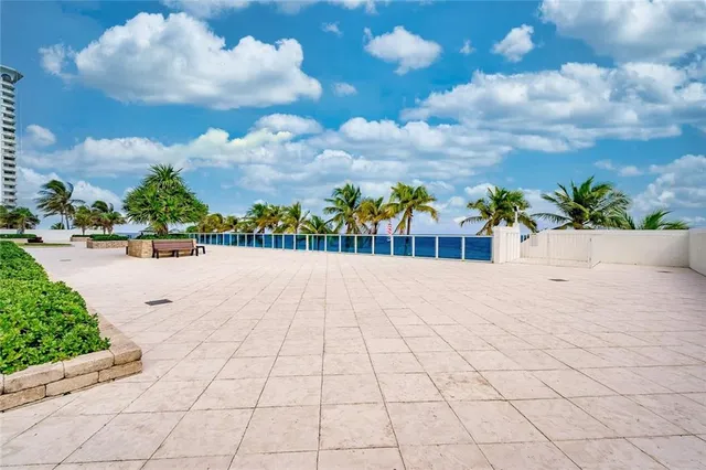 a living room with furniture a table and chairs