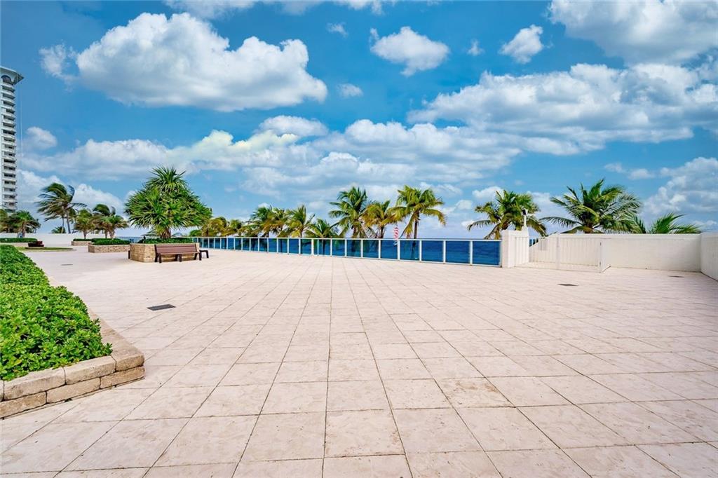 1360 South Ocean Boulevard, Unit 905 Pompano Beach, FL 33062 - Photo 37 of 57 OCEANSIDE DECK WITH STAIRWAY TO BEACH (ON RIGHT)