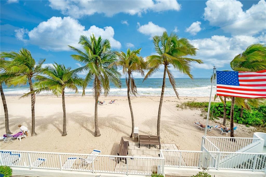 1360 South Ocean Boulevard, Unit 905 Pompano Beach, FL 33062 - Photo 39 of 57 a view of a swimming pool with a lounge chair