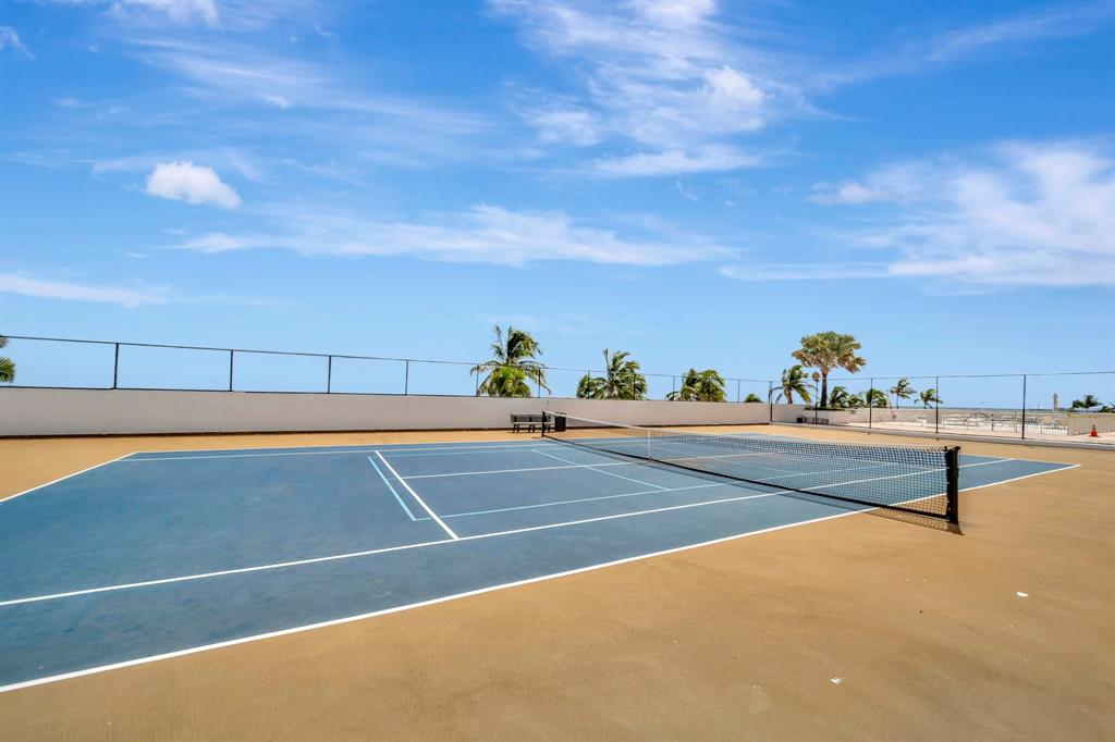 1360 South Ocean Boulevard, Unit 905 Pompano Beach, FL 33062 - Photo 43 of 57 a view of a tennis court