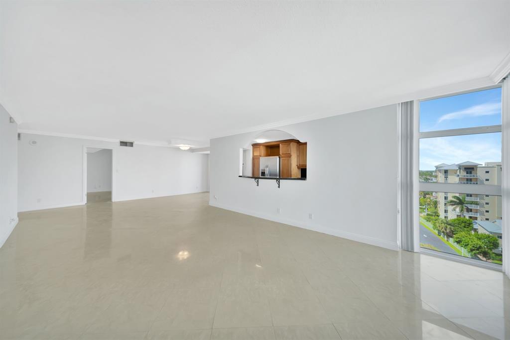 1360 South Ocean Boulevard, Unit 905 Pompano Beach, FL 33062 - Photo 5 of 57 a view of a room with a window and wooden floor