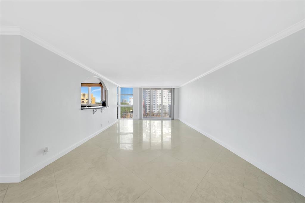 1360 South Ocean Boulevard, Unit 905 Pompano Beach, FL 33062 - Photo 8 of 57 wooden floor in an empty room with a window