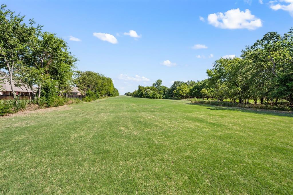 13109 Roanoke Road Westlake, TX 76262 - Photo 27 of 35 a view of a field with trees in the background