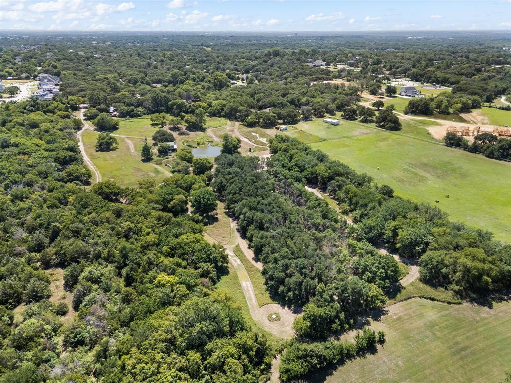 13109 Roanoke Road Westlake, TX 76262 - Photo 32 of 35 an aerial view of residential houses with outdoor space and trees