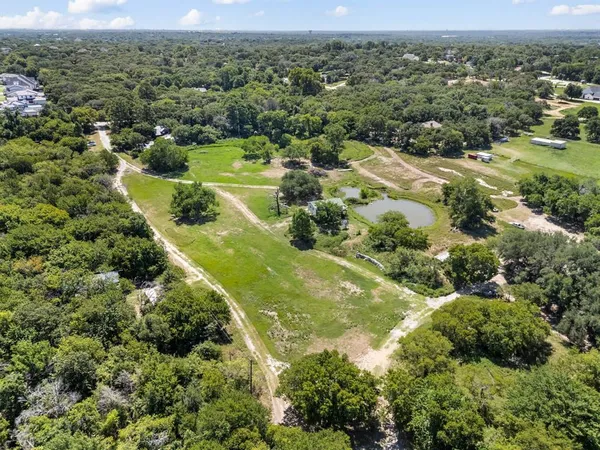 a view of a yard with swimming pool