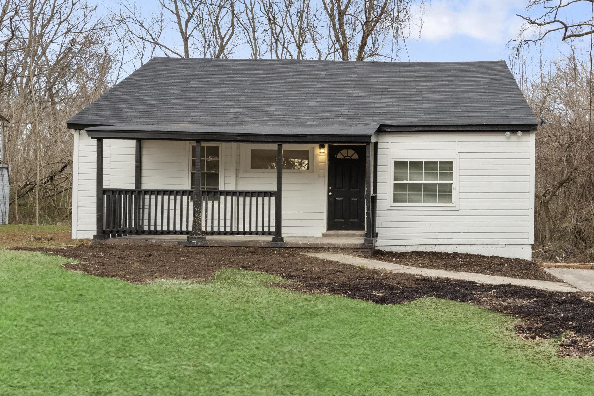 3726 Mart Road Memphis, TN 38109 - Photo 1 of 33 a front view of a house with a yard