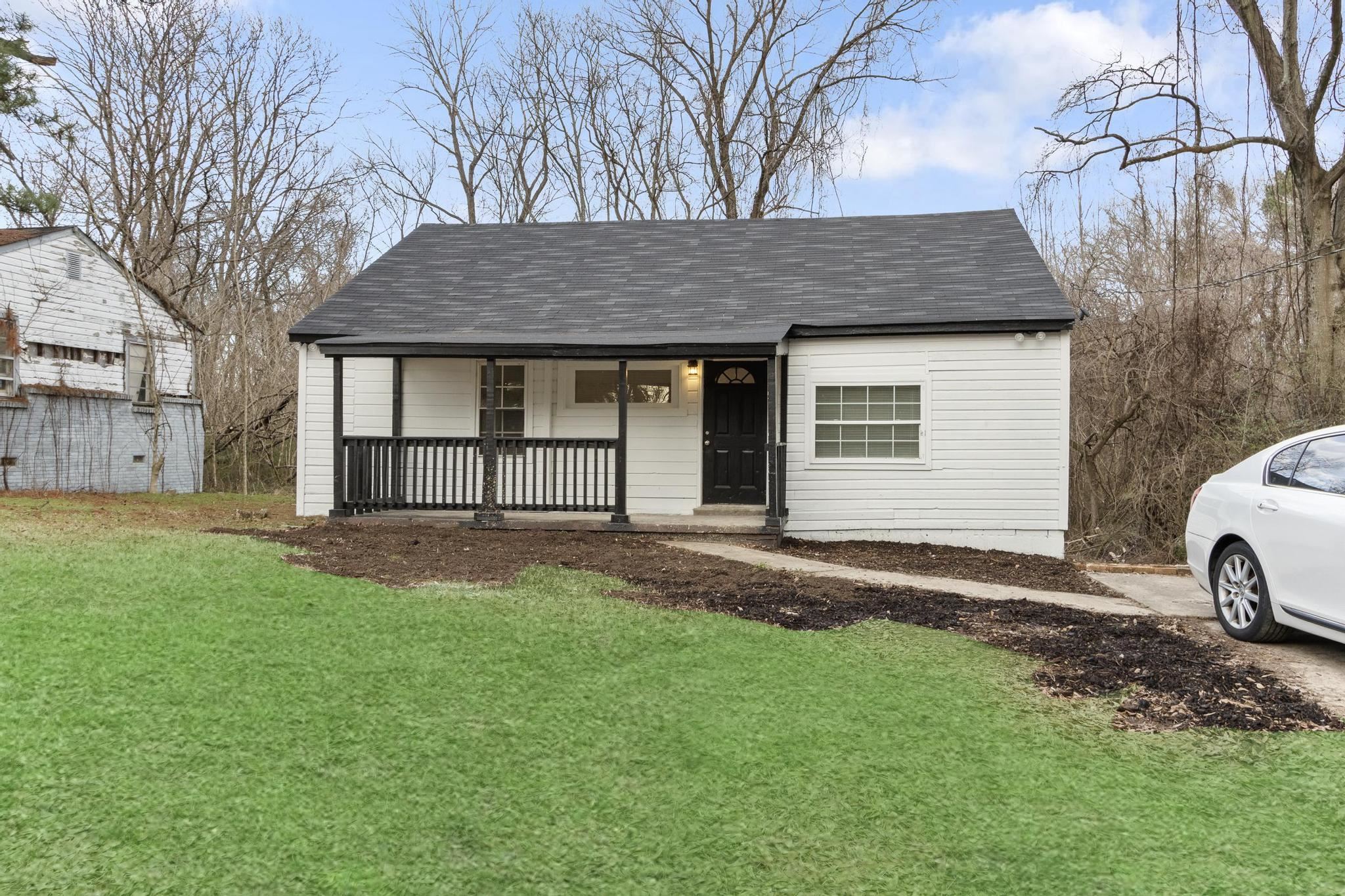 3726 Mart Road Memphis, TN 38109 - Photo 2 of 33 a view of a house with yard