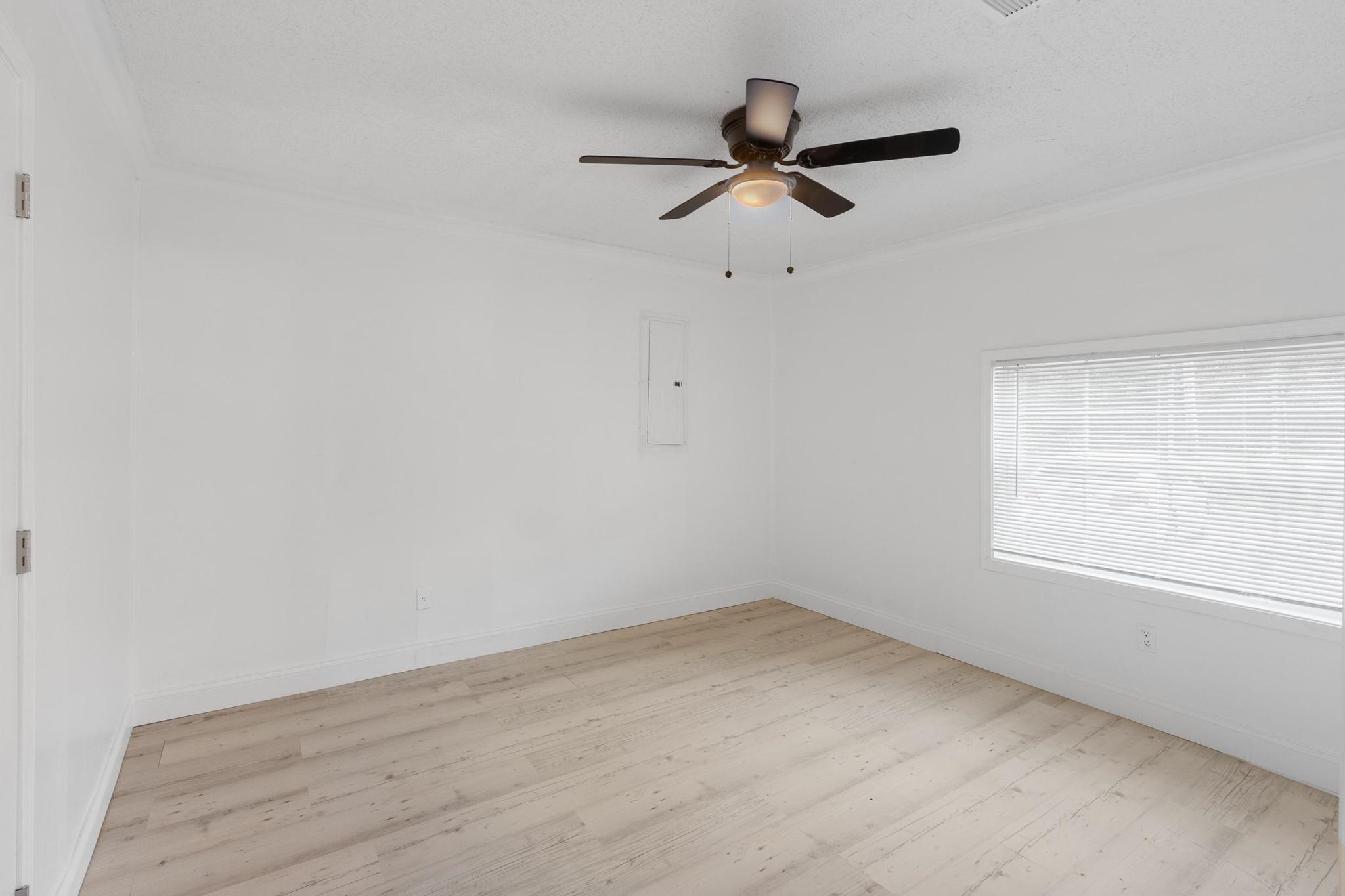 3726 Mart Road Memphis, TN 38109 - Photo 22 of 33 wooden floor in an empty room with a window