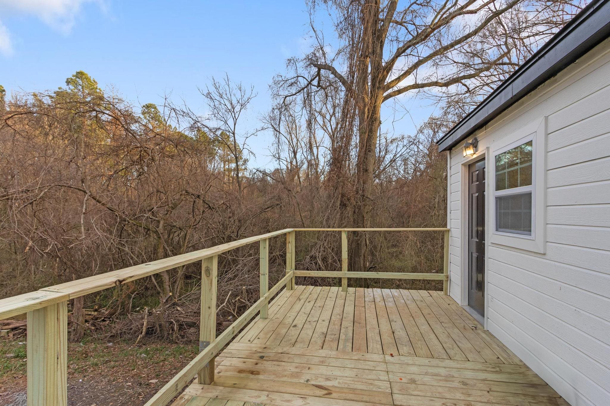 3726 Mart Road Memphis, TN 38109 - Photo 31 of 33 a view of balcony with wooden floor and fence