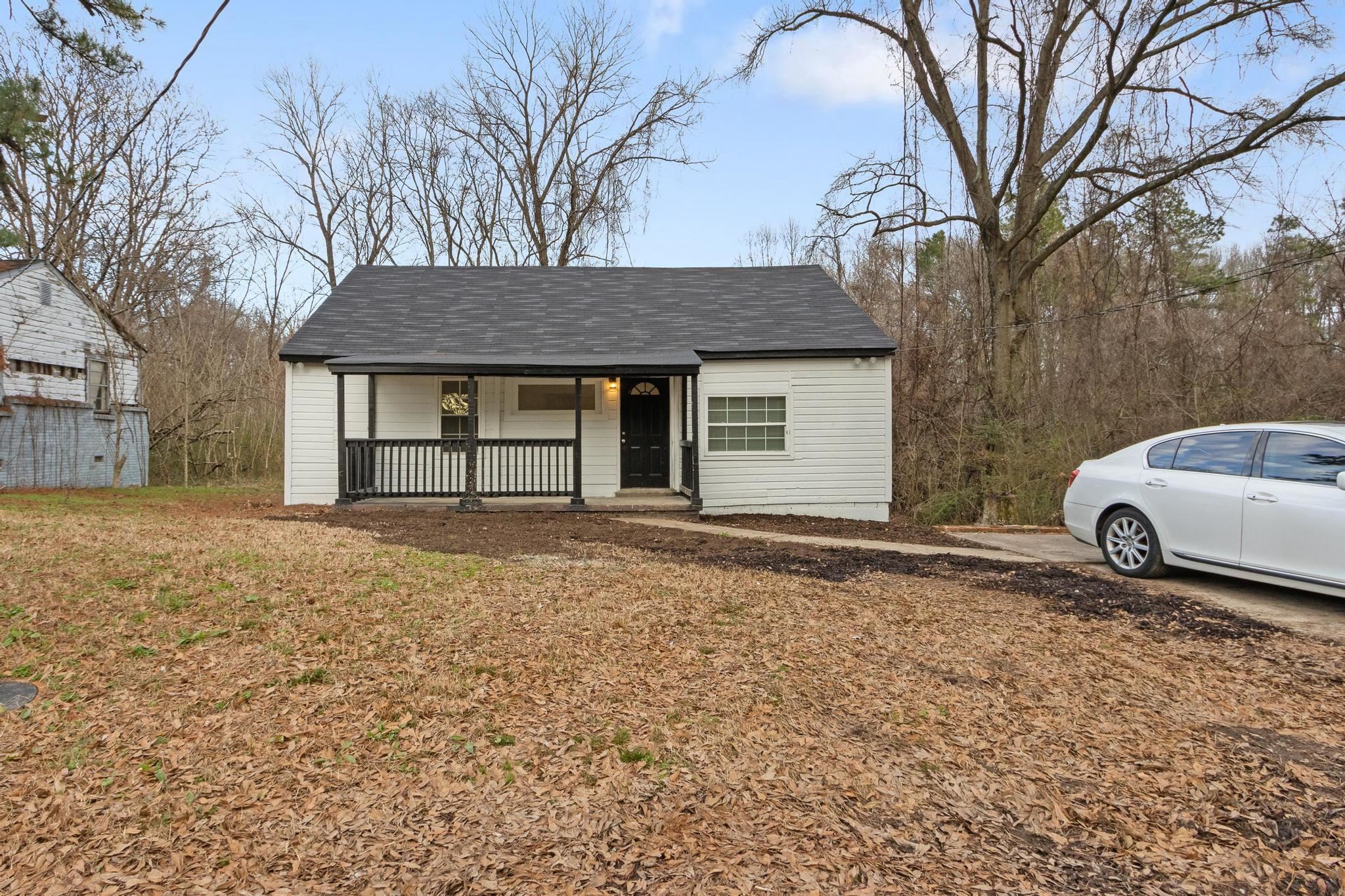 3726 Mart Road Memphis, TN 38109 - Photo 5 of 33 a house with a tree in front of it