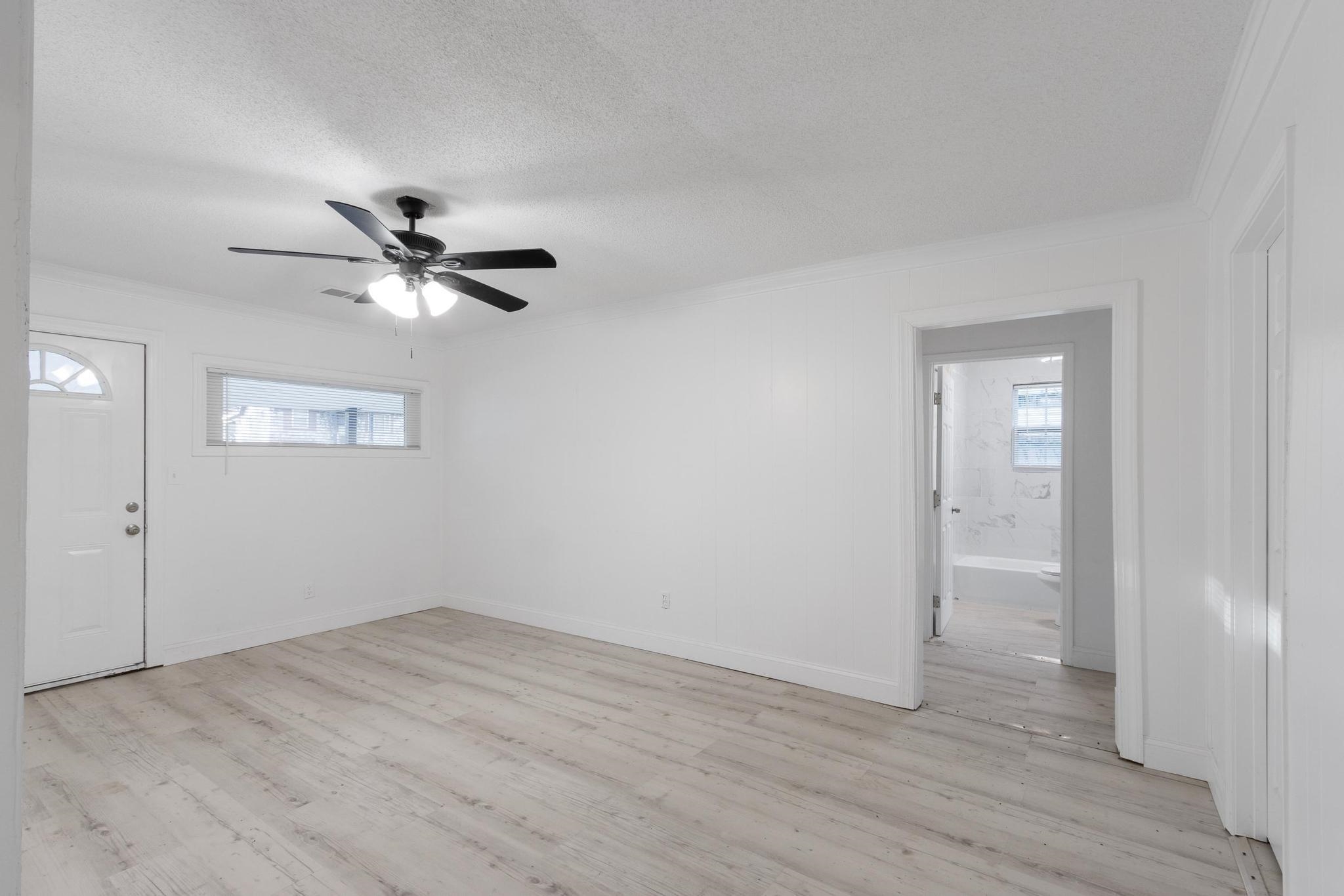 3726 Mart Road Memphis, TN 38109 - Photo 9 of 33 wooden floor in an empty room with a window