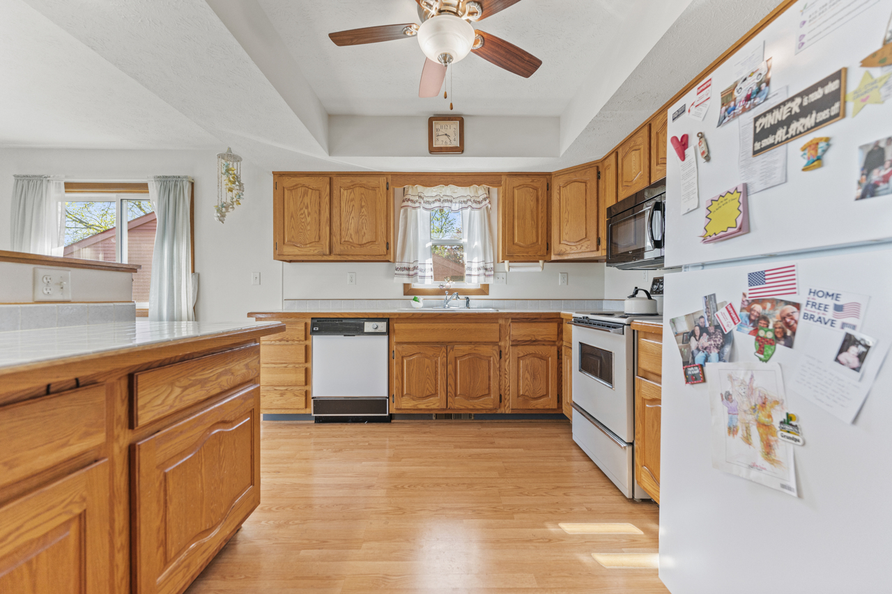 860 Breckenboro Road Davis, IL 61019 - Photo 13 of 26 a kitchen with stainless steel appliances granite countertop a stove and a sink