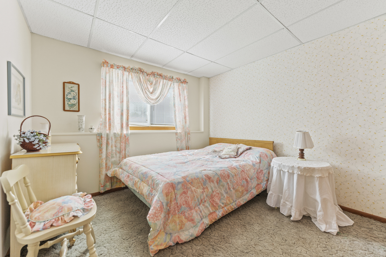 860 Breckenboro Road Davis, IL 61019 - Photo 17 of 26 a bedroom with a bed and wooden floor