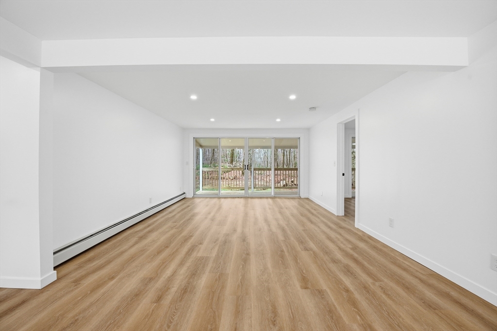 309 Pleasant Street Paxton, MA 01612 - Photo 12 of 27 a view of an empty room with wooden floor and a window