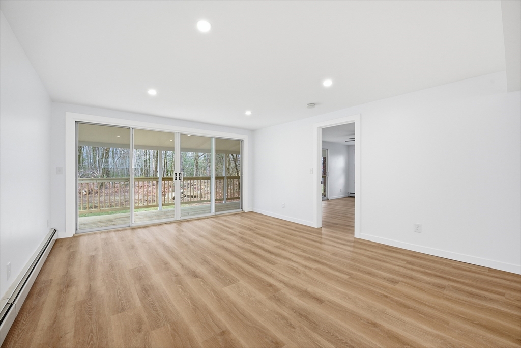 309 Pleasant Street Paxton, MA 01612 - Photo 13 of 27 a view of an empty room with wooden floor and a window