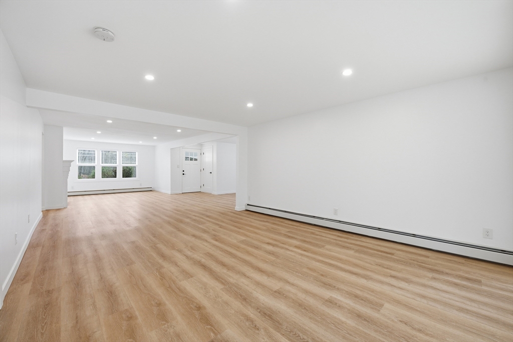 309 Pleasant Street Paxton, MA 01612 - Photo 15 of 27 an empty room with wooden floor and windows