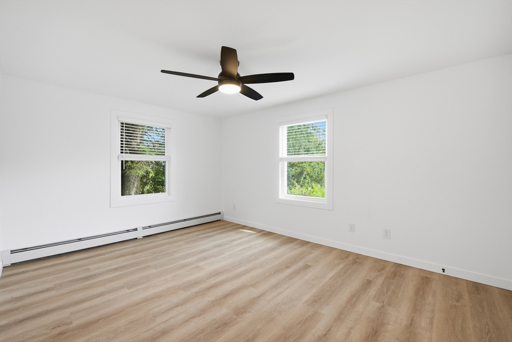 309 Pleasant Street Paxton, MA 01612 - Photo 22 of 27 wooden floor in an empty room with a window
