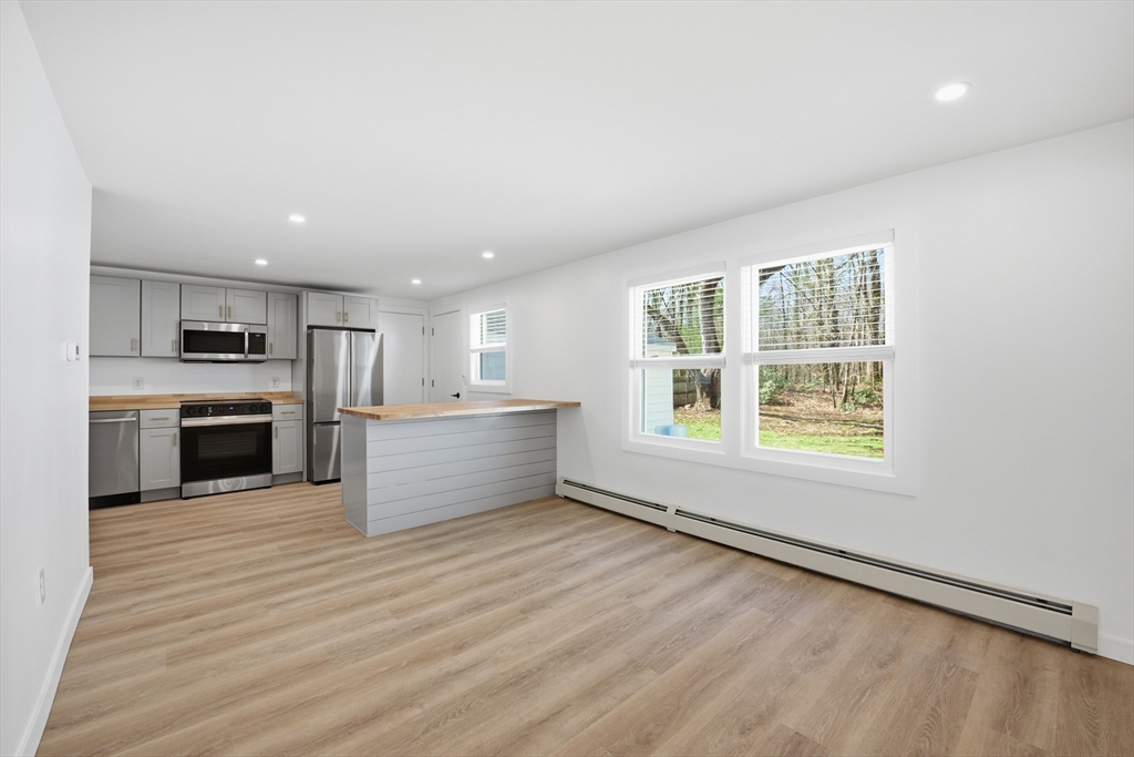 309 Pleasant Street Paxton, MA 01612 - Photo 5 of 27 a view of kitchen with granite countertop cabinets and wooden floor
