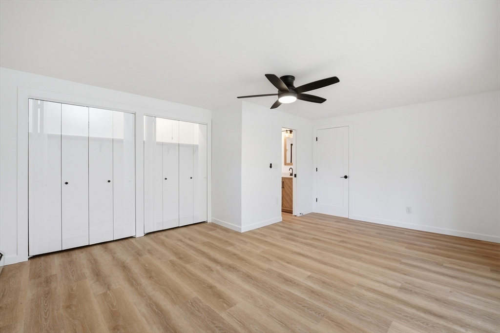 309 Pleasant Street Paxton, MA 01612 - Photo 6 of 27 a view of a livingroom with a ceiling fan and wooden floor