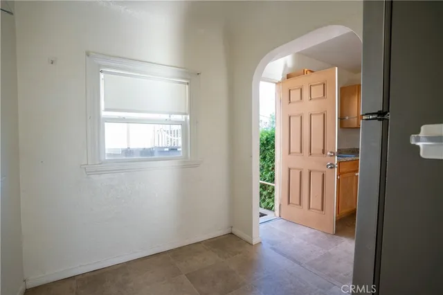 a view of an entryway with wooden floor