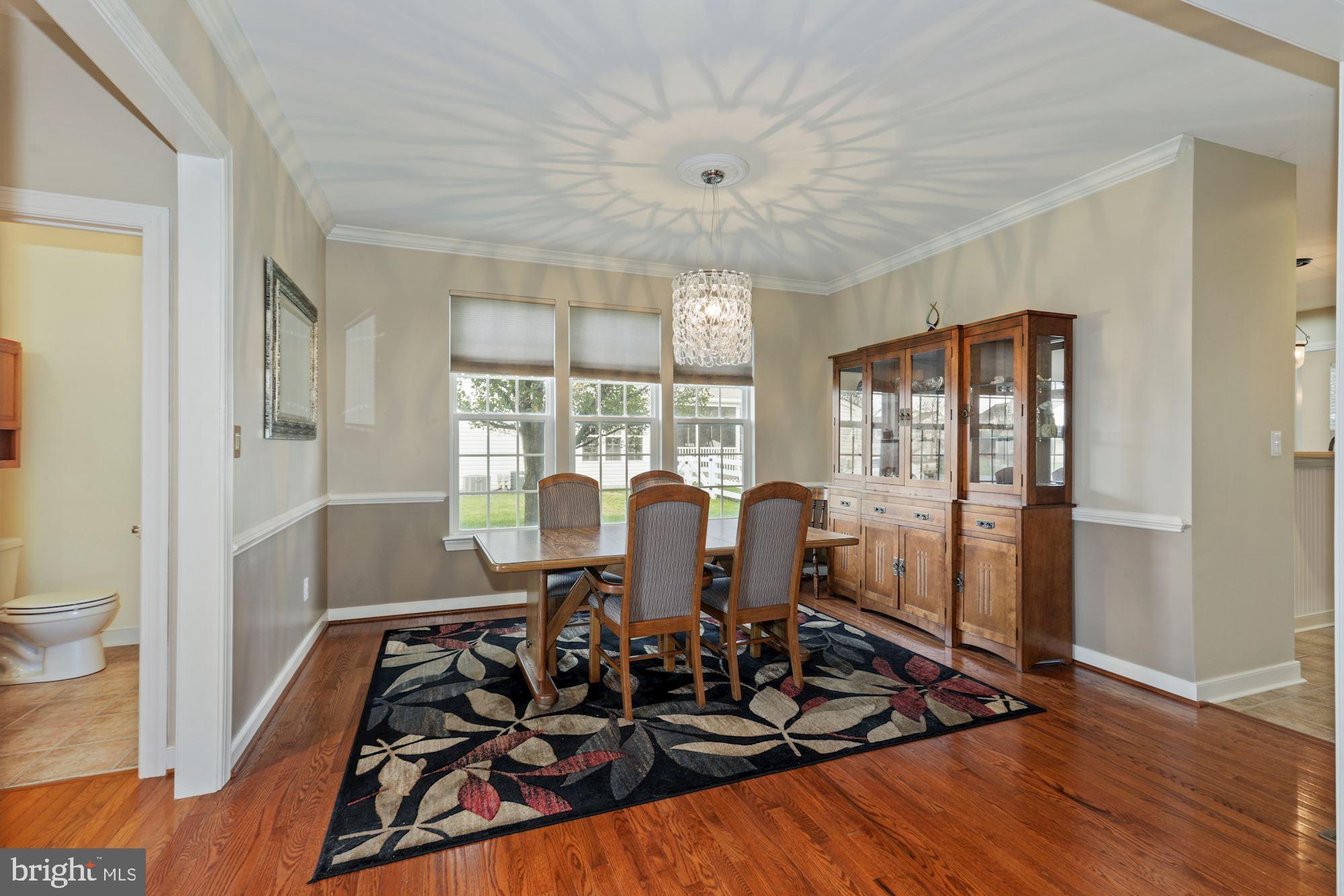 24776 Rivers Edge Road Millsboro, DE 19966 - Photo 11 of 53 Delicate Dining Room with Decorative Moldings