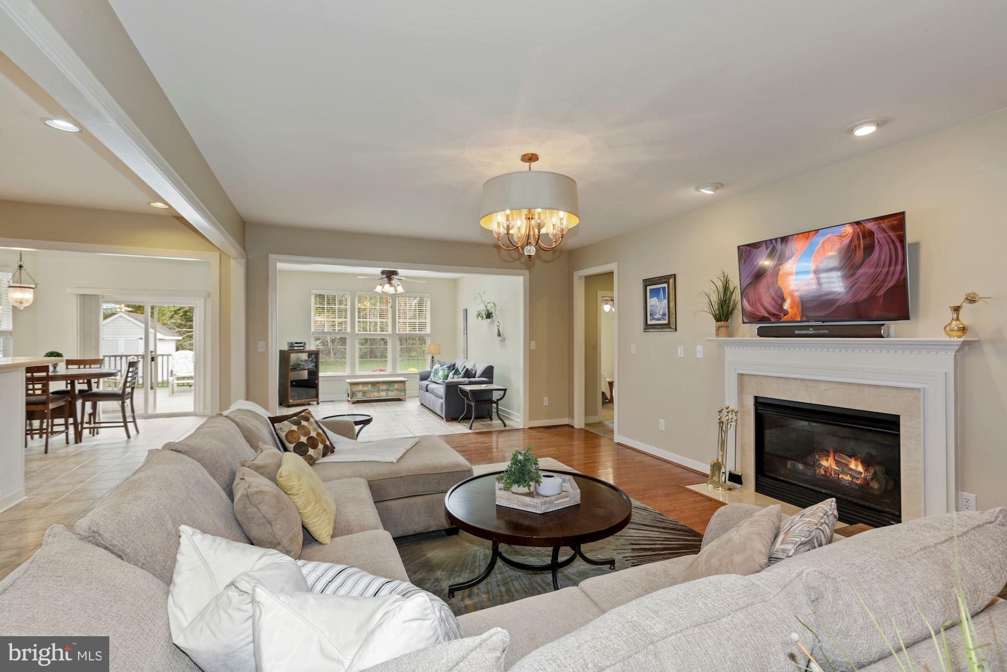 24776 Rivers Edge Road Millsboro, DE 19966 - Photo 13 of 53 Lovely Living Room with Gas Fireplace