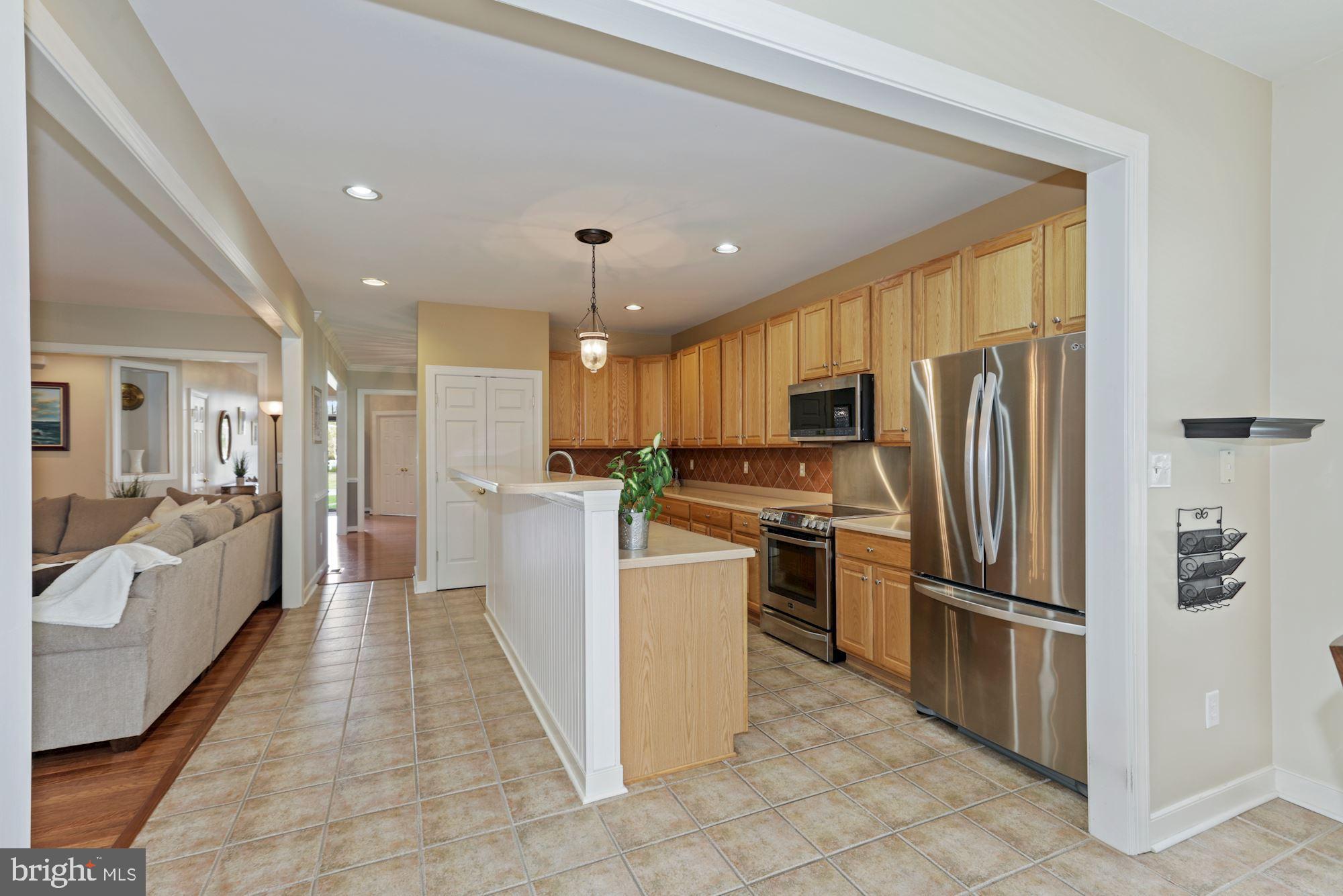 24776 Rivers Edge Road Millsboro, DE 19966 - Photo 17 of 53 Gorgeous Kitchen with Breakfast Bar