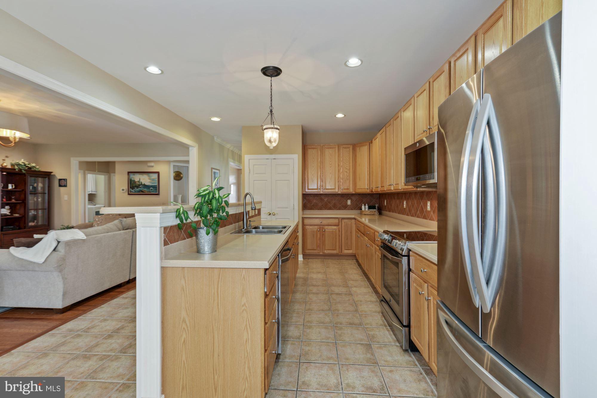 24776 Rivers Edge Road Millsboro, DE 19966 - Photo 18 of 53 Gorgeous Kitchen with Solid Surface Counters