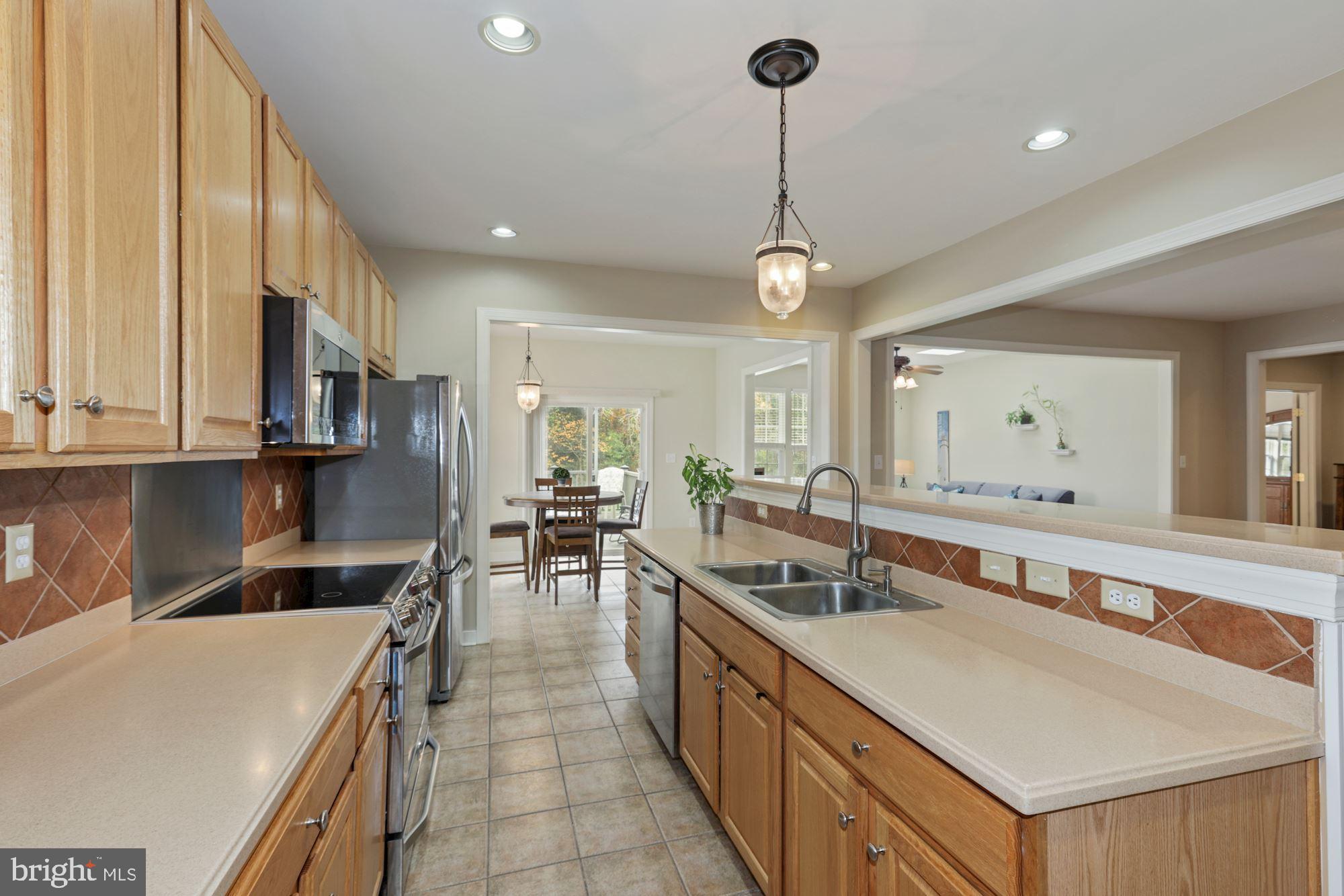 24776 Rivers Edge Road Millsboro, DE 19966 - Photo 19 of 53 Gorgeous Kitchen with Stainless Steel Appliances