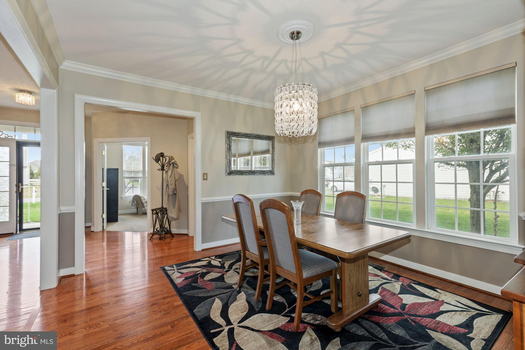 24776 Rivers Edge Road Millsboro, DE 19966 - Photo 10 of 53 Delicate Dining Room with Decorative Moldings