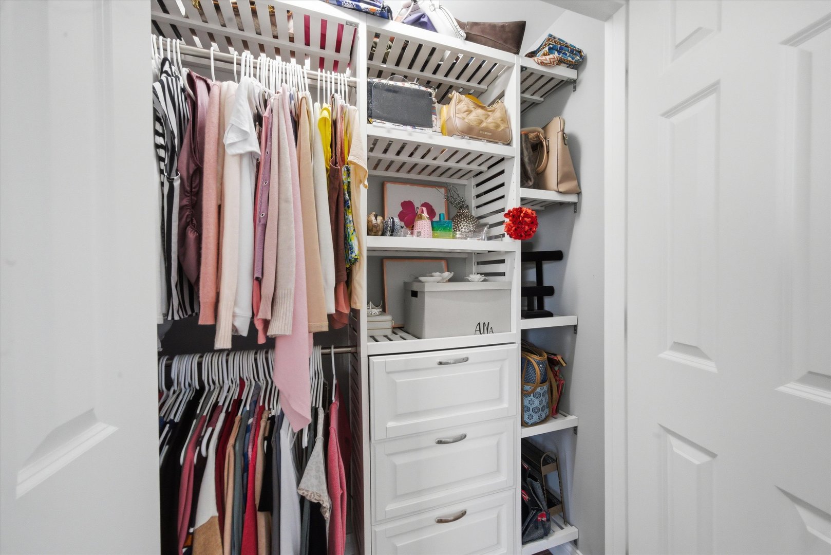 2448 Emily Lane Elgin, IL 60124 - Photo 18 of 34 a view of walk in closet with clothes and shoes