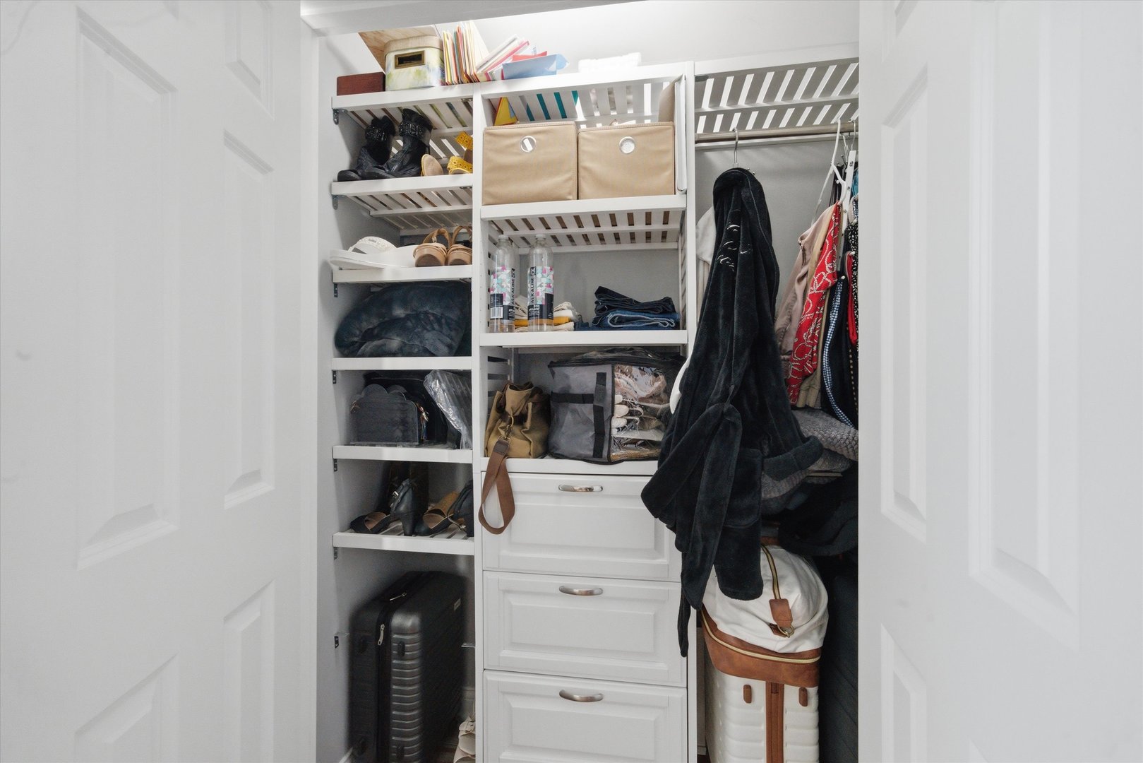 2448 Emily Lane Elgin, IL 60124 - Photo 19 of 34 a view of walk in closet with clothes and shoes