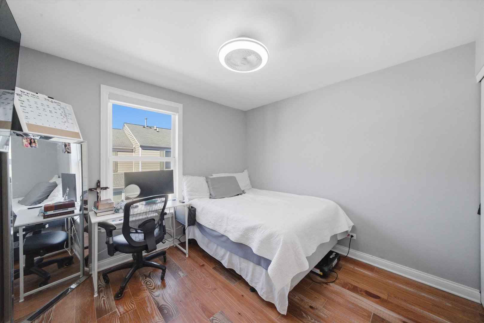 2448 Emily Lane Elgin, IL 60124 - Photo 22 of 34 a bedroom with a bed and a table in it
