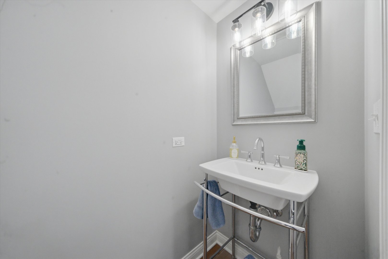 2448 Emily Lane Elgin, IL 60124 - Photo 25 of 34 a bathroom with a sink a mirror and a toilet