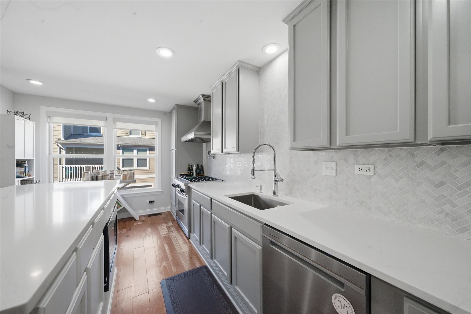 2448 Emily Lane Elgin, IL 60124 - Photo 7 of 34 a kitchen with stainless steel appliances a sink stove and cabinets
