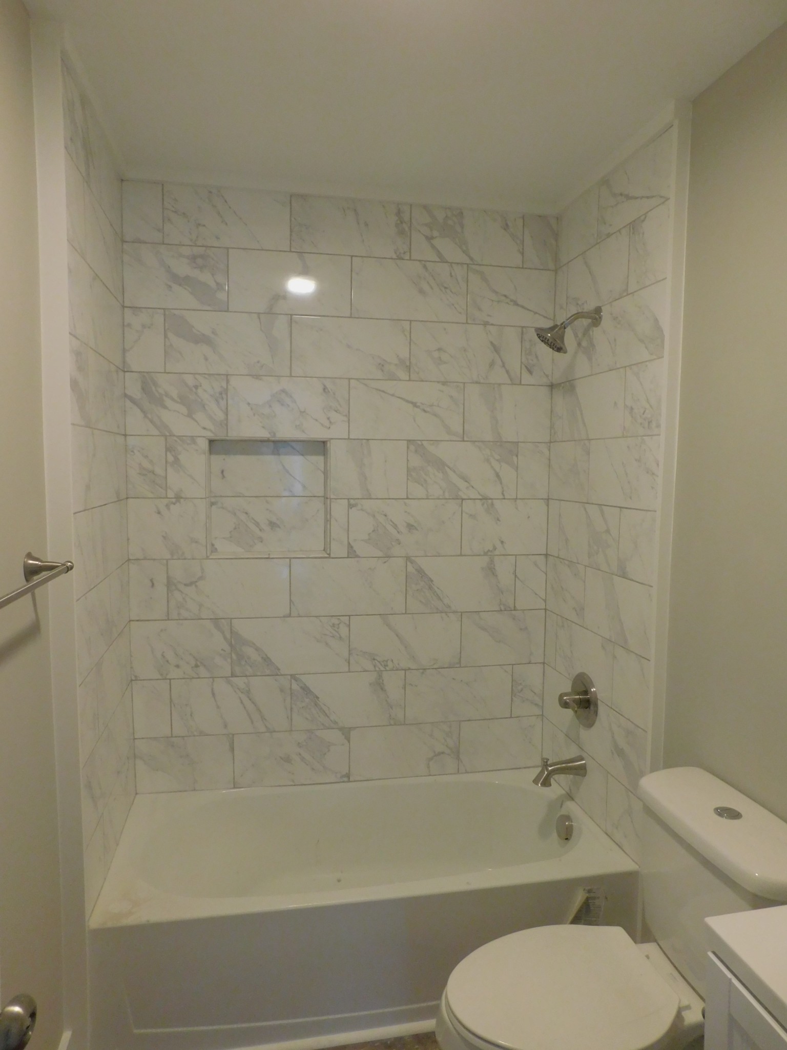 736 Riley Creek Road Tullahoma, TN 37388 - Photo 11 of 25 a bathroom with a toilet and a bathtub