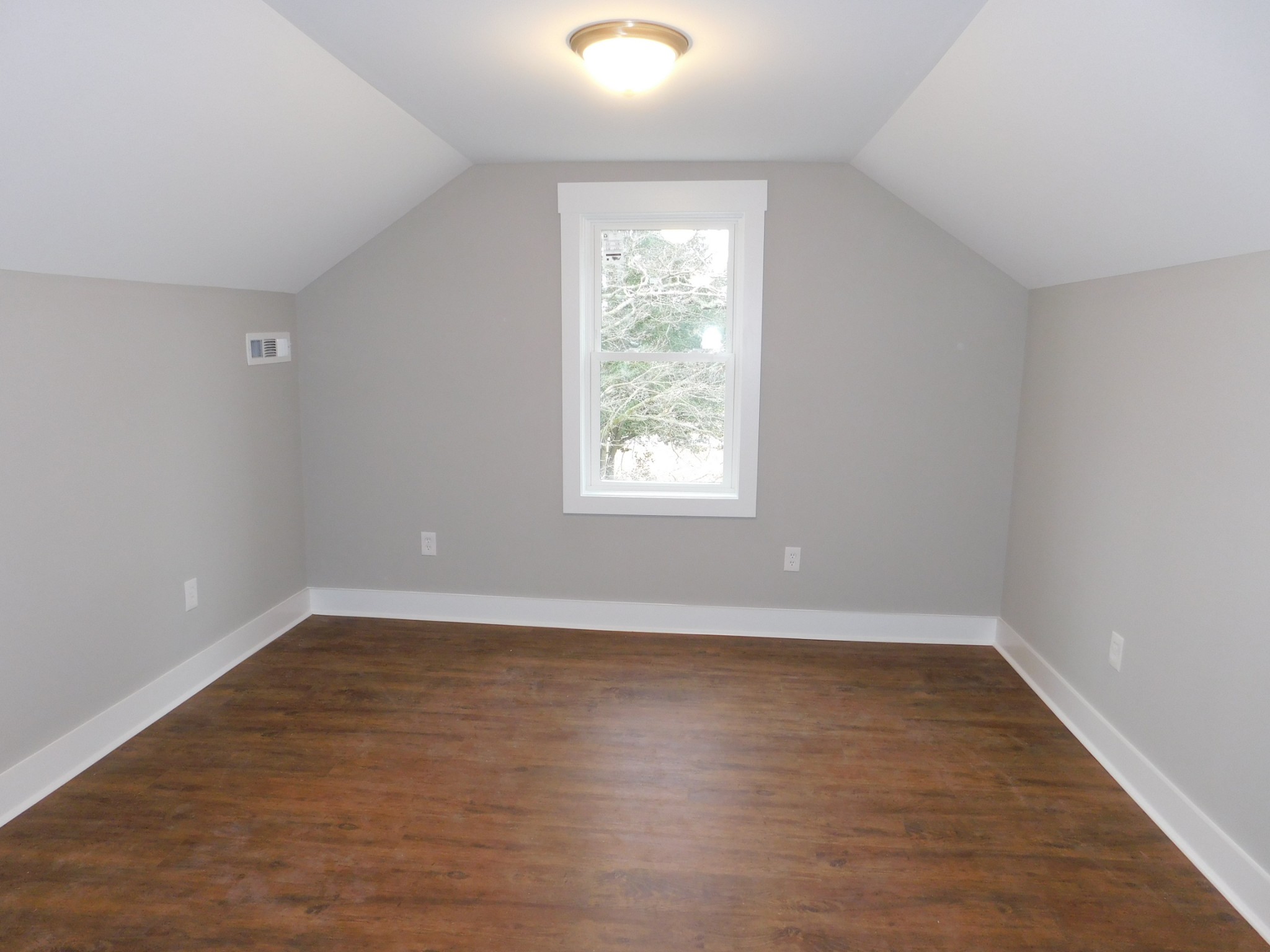 736 Riley Creek Road Tullahoma, TN 37388 - Photo 14 of 25 a view of an empty room with wooden floor and a window