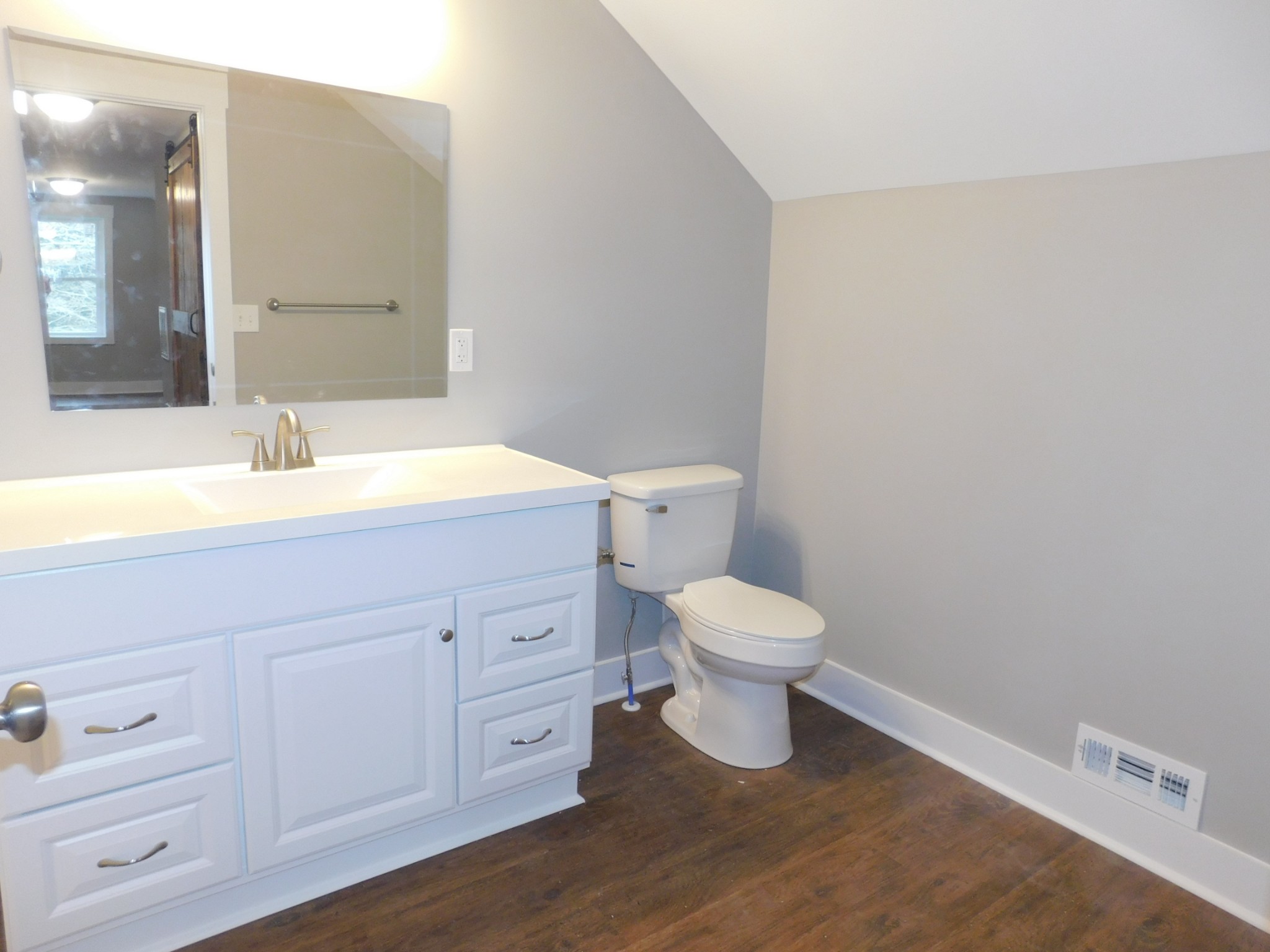 736 Riley Creek Road Tullahoma, TN 37388 - Photo 17 of 25 a bathroom with a toilet sink and mirror