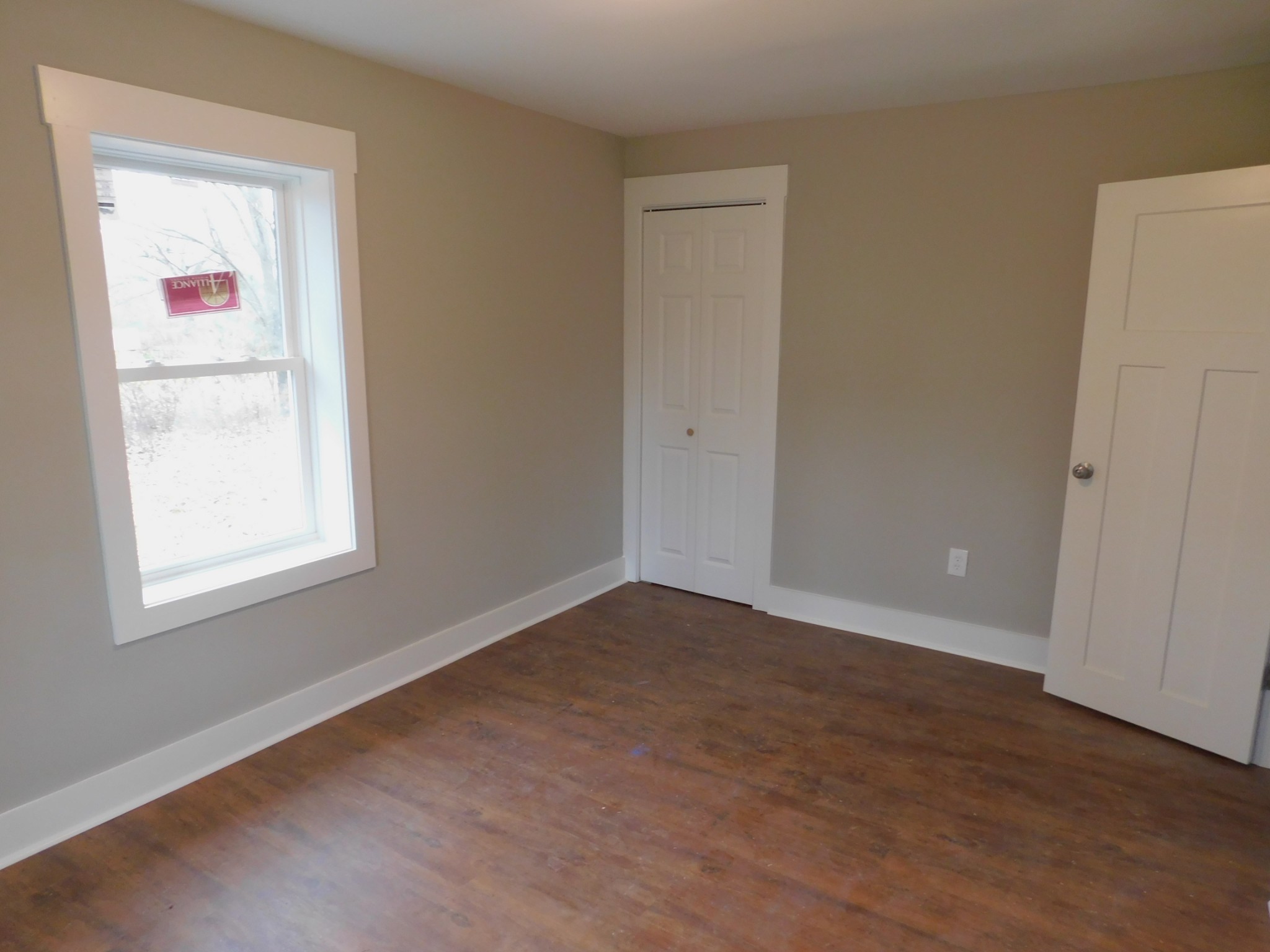 736 Riley Creek Road Tullahoma, TN 37388 - Photo 20 of 25 an empty room with wooden floor and windows