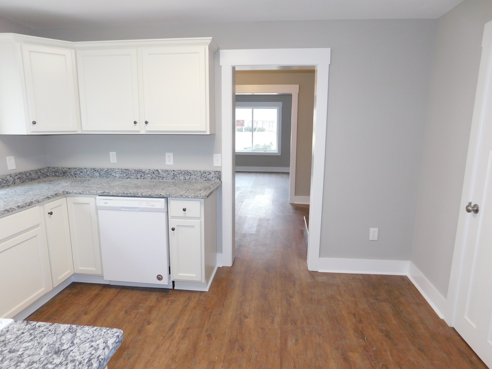736 Riley Creek Road Tullahoma, TN 37388 - Photo 9 of 25 an empty room with wooden floor and cabinet